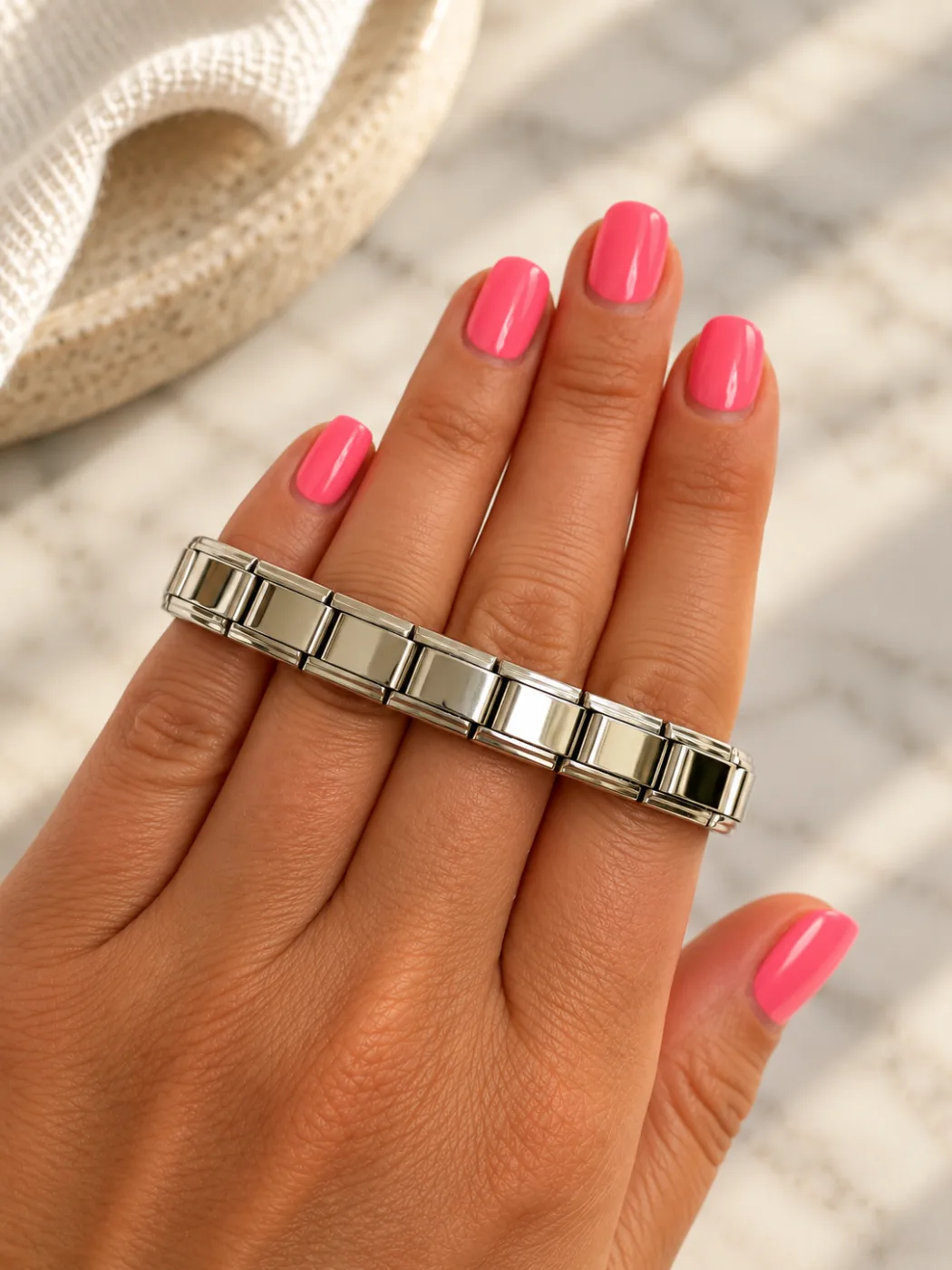 Stainless steel bracelet worn across a hand